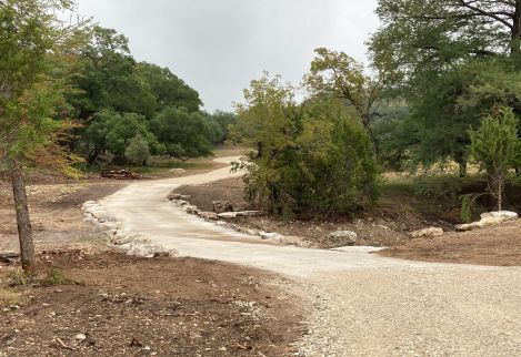 Finished and ready for rain, this concrete crossing created a beautiful water feature when the rains returned.