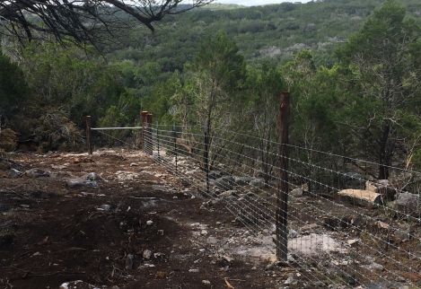 We specialize in building cedar fence in rocky, topographical terrain
